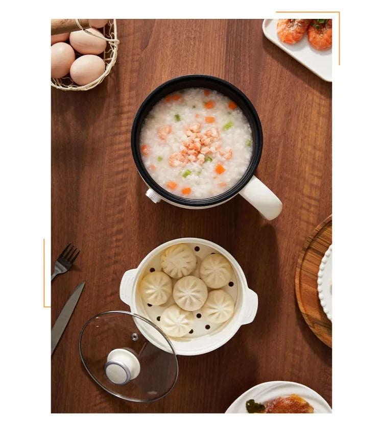 Hot pot base in use with food bowls—white steaming pot with black inner insert