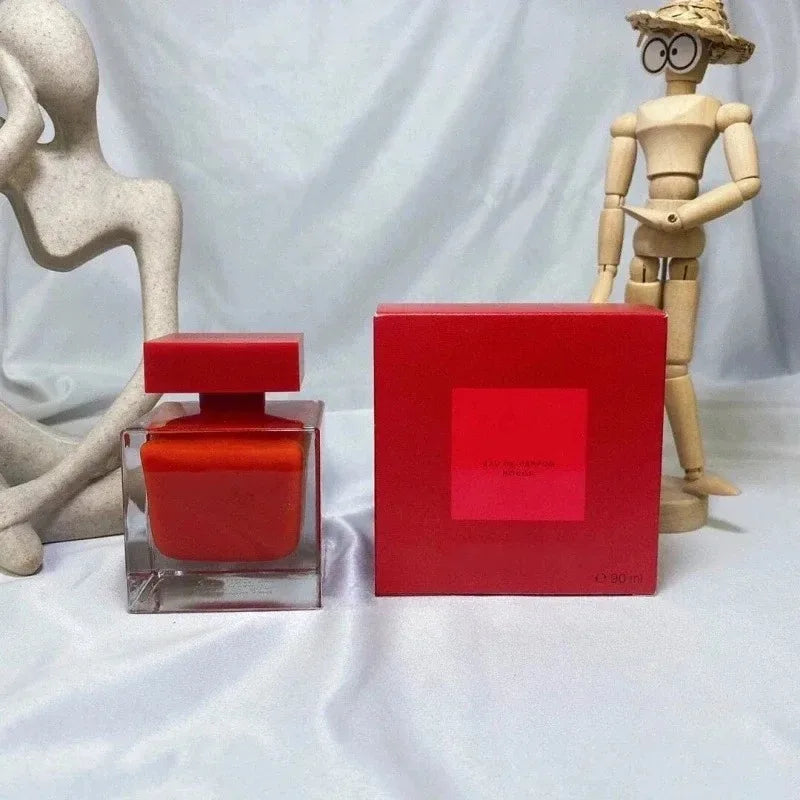 Woody floral Eau de Parfum for women. Red square glass bottle and box. Long-lasting pure musk extract fragrance.