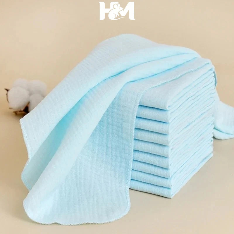 Soft light blue baby care washcloths or muslin burp cloths, stacked set for delicate newborn skin.
