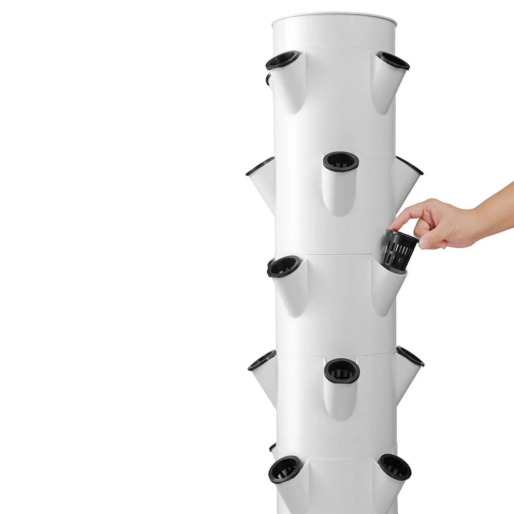 White vertical aeroponic tower with multiple plant holes and circular openings