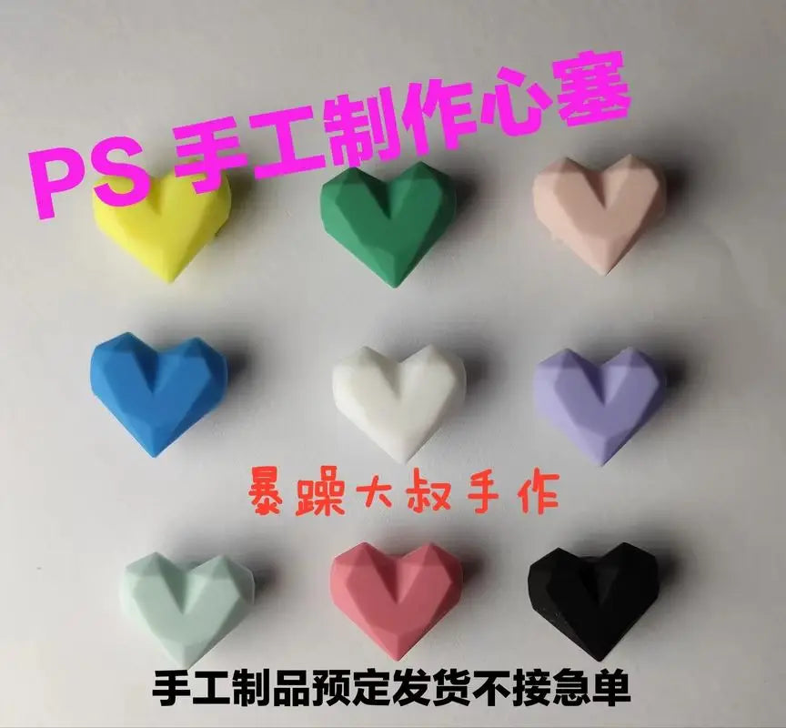 Colorful silicone heart dust plugs for Tamagotchi Uni, protective hard shell accessories to keep charging ports clean.