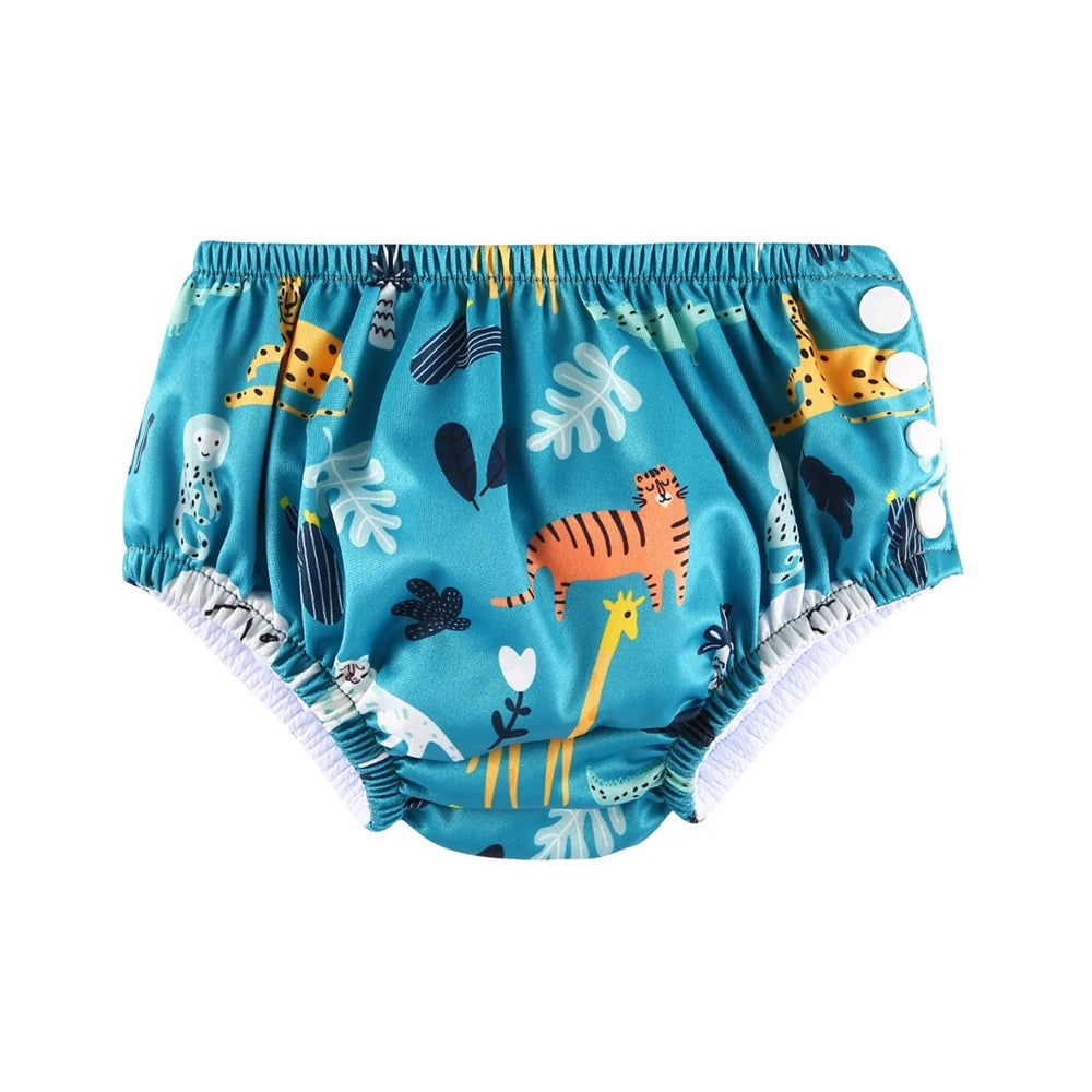 Adjustable teal baby swim diaper with colorful jungle animal pattern and snap sides. Waterproof baby care product.