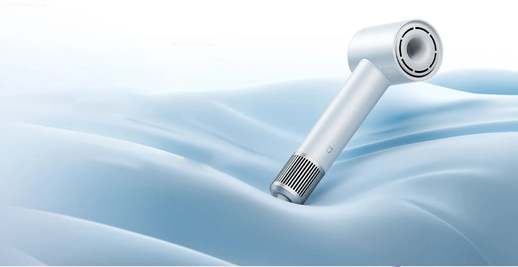 White Mijia H501 high-speed negative ion hair dryer with sleek, minimalist design on blue fabric background.