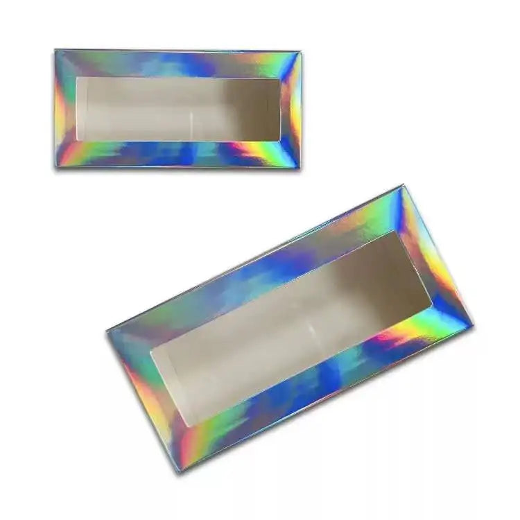 Two empty rectangular eyelash packaging boxes with a holographic, iridescent finish and a clear viewing window.