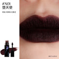DE'LANCI dark red shimmering lip mud with a gothic, matte-textured finish on lips for a high-color smoky punk look.