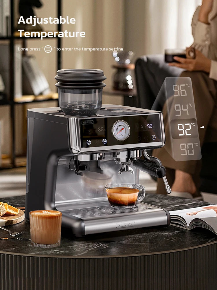 HiBREW black and silver espresso machine with grinder, digital temperature display, and pressure gauge on table.