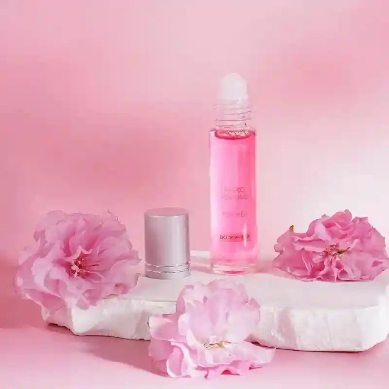 Flirting Phero Perfume for women: long-lasting pheromone EDP roll-on oil in a glass bottle with pink floral decor.