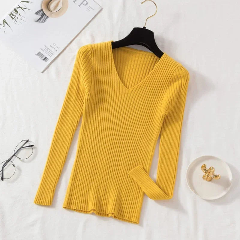 Tidesmit mustard yellow ribbed knit sweater with a V-neckline and long sleeves, hanging against a white background.