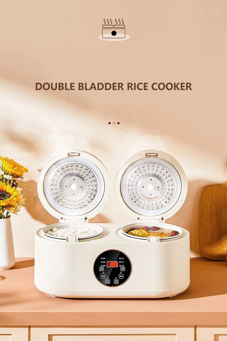 White double rice cooker front view with two lid tops and steaming inserts