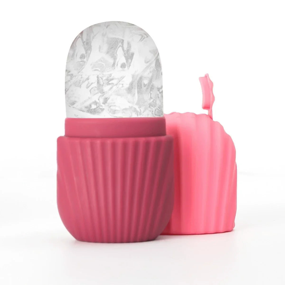 Pink silicone ice face roller with a dome-shaped ice head and a textured, ribbed handle.