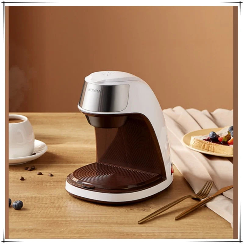 Konka white and brown single-serve coffee maker on a wooden table with a breakfast setting.