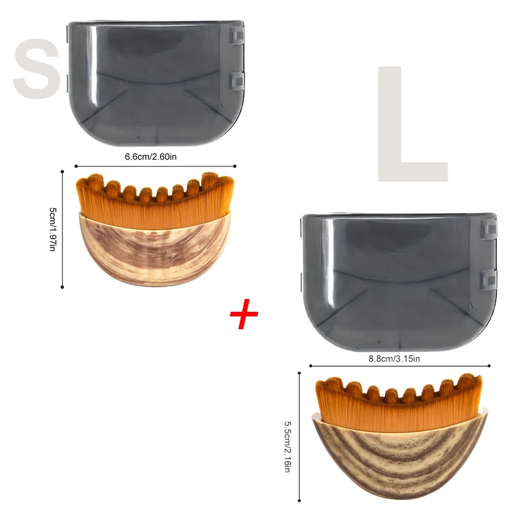 Small and large facial massage brushes with wood-grain handles, amber bristles, and protective grey storage cases.