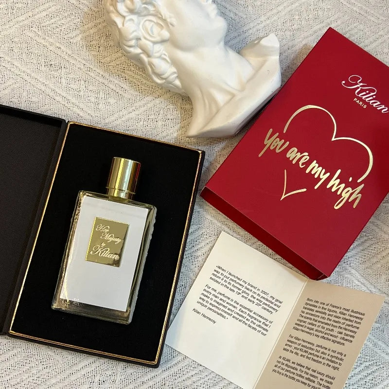 Kilian Her Majesty unisex perfume: 50ml floral chypre with peach, rum, rose, cedar. Elegant rectangular glass bottle.