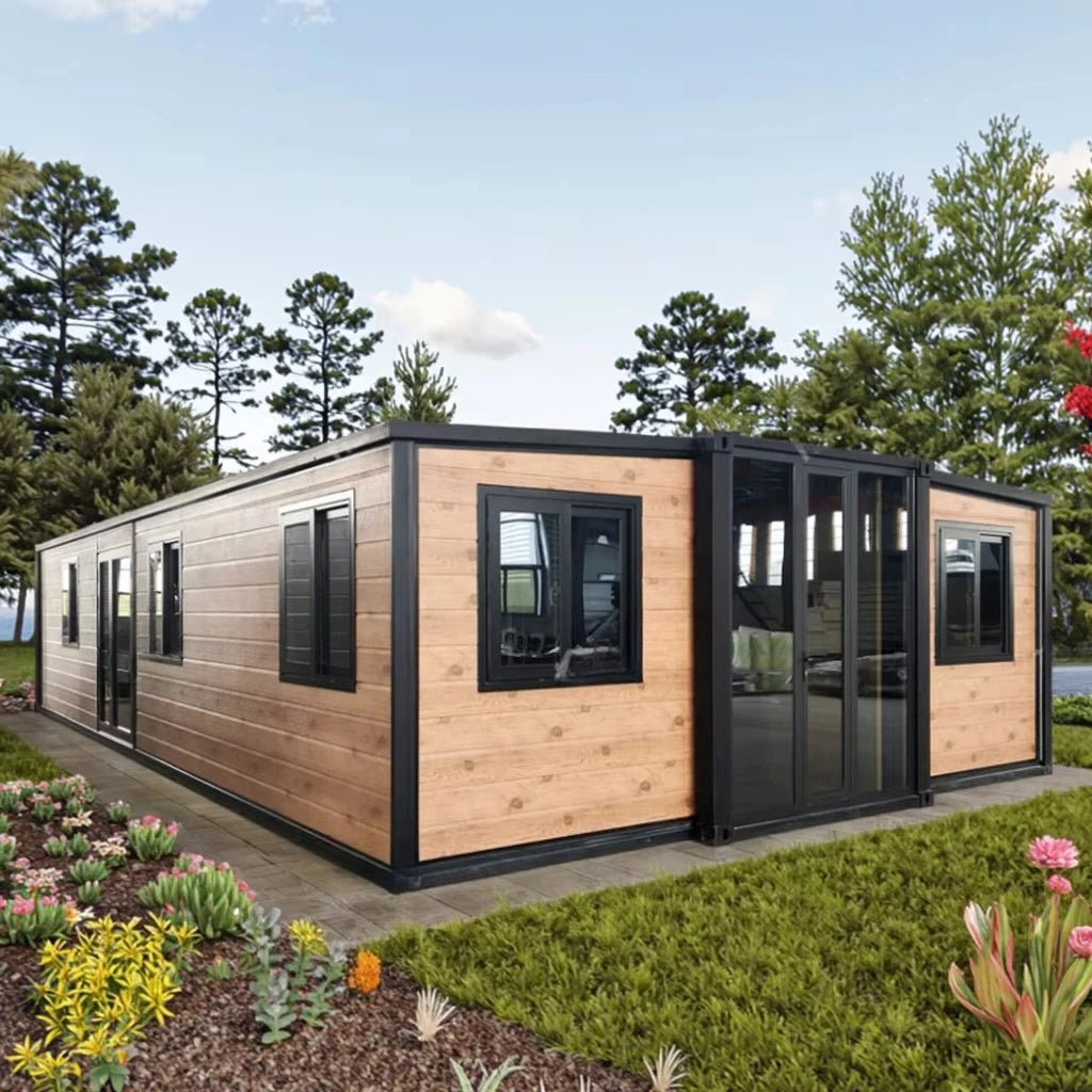 Wood and gray modular container house with black-framed windows and sliding doors