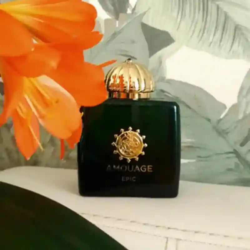 Amouage Epic Woman 100ml EDP, a lush floral oriental chypre in a rectangular green bottle with a gold emblem.