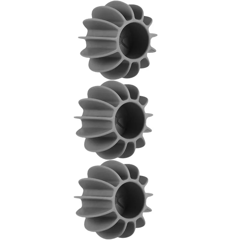 Grey reusable silicone laundry balls for removing cat and dog hair from clothes in the washing machine.