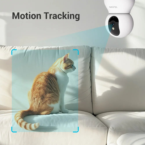 Indoor security camera mounted near a sofa for motion tracking, facing the room.