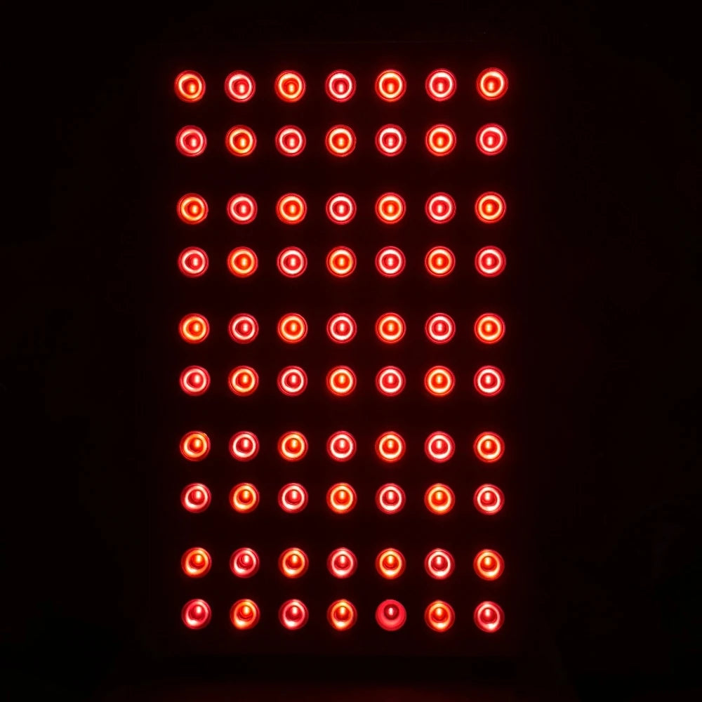 Red light therapy panel with LED array for anti-aging and pain relief, glowing against a black background.