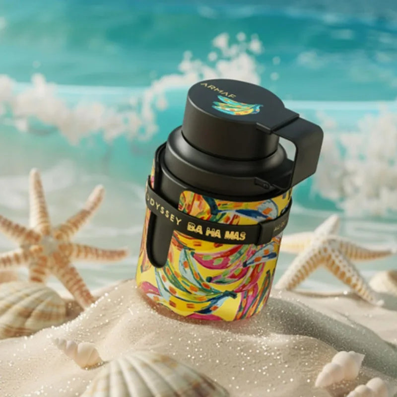 Armaf Odyssey Bahamas EDP: Unisex woody perfume in unique round tropical bottle on beach, perfect for daily wear gift.