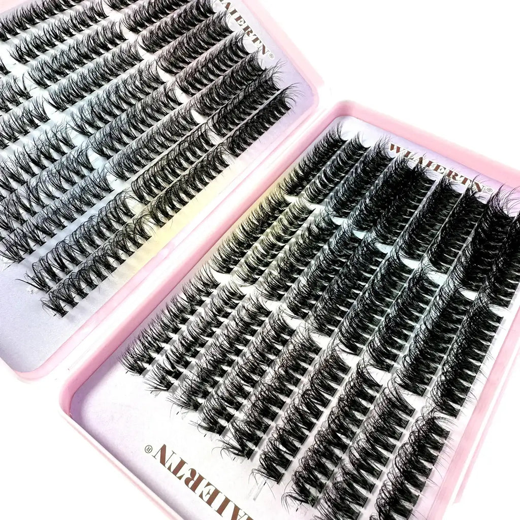 Two pink trays filled with rows of black individual synthetic false eyelash clusters for makeup application.