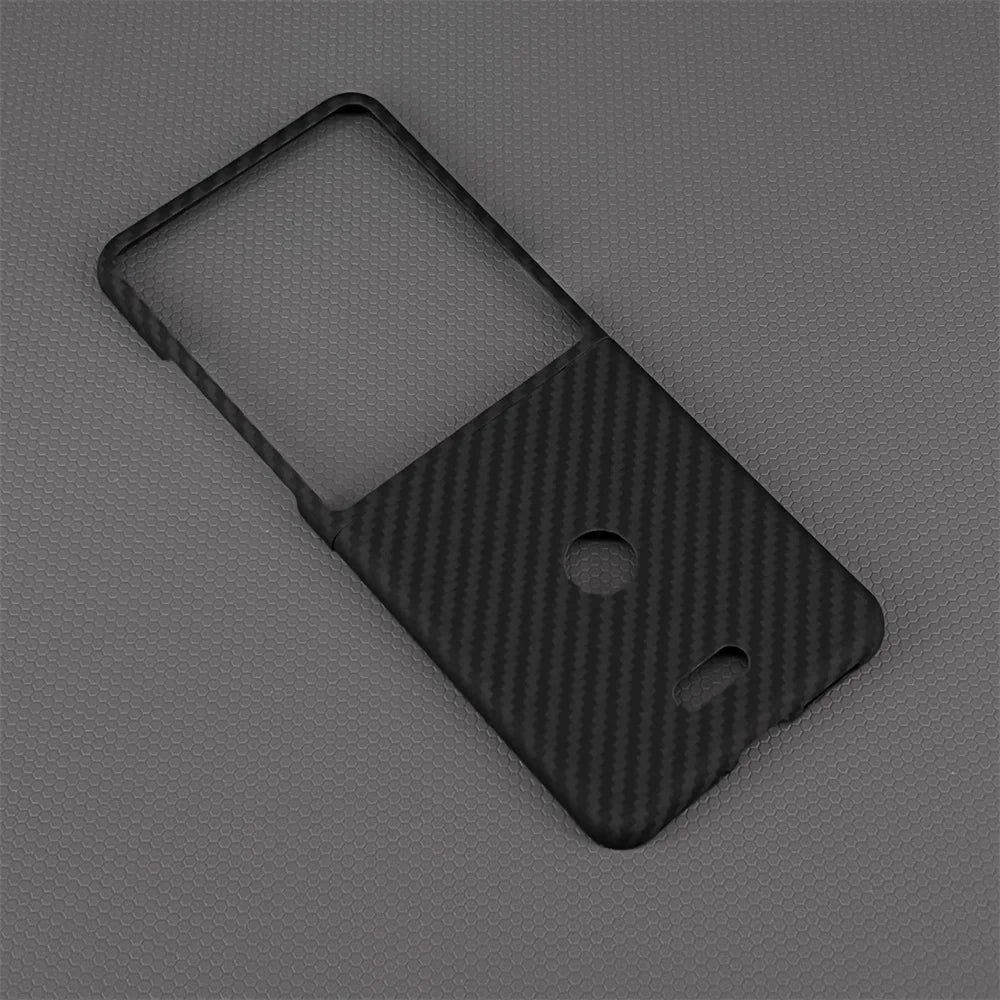 Black carbon fiber protective cover for a flip phone, featuring precise cutouts for the camera and flash.