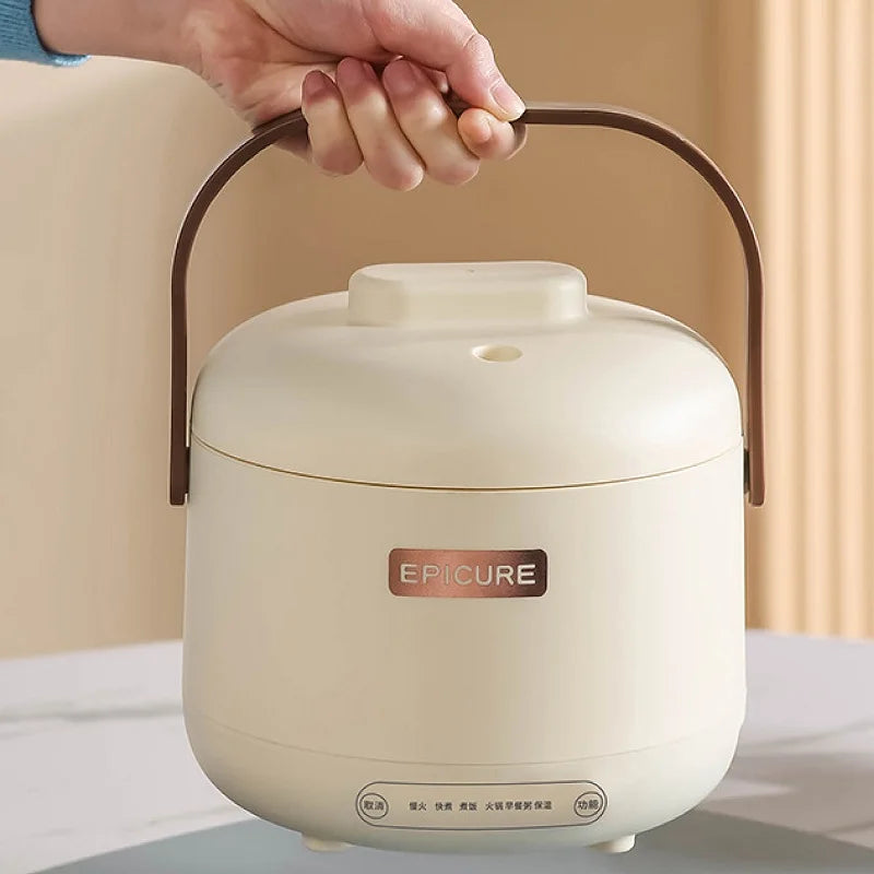 White mini electric rice cooker with lid and brown carry handle, compact countertop size.