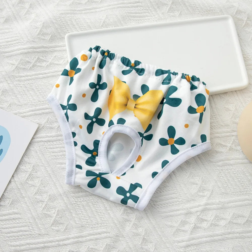 Washable floral pet diapers for small dogs and cats. Reusable sanitary pants with yellow bow for female heat protection.