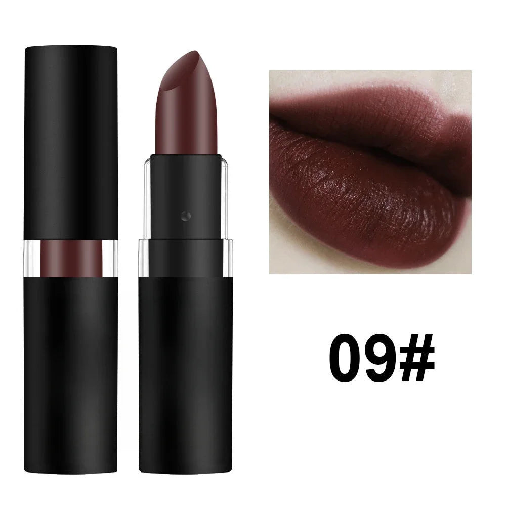 Dark wine red matte lipstick in a black tube, featuring a waterproof, highly pigmented swatch on lips.