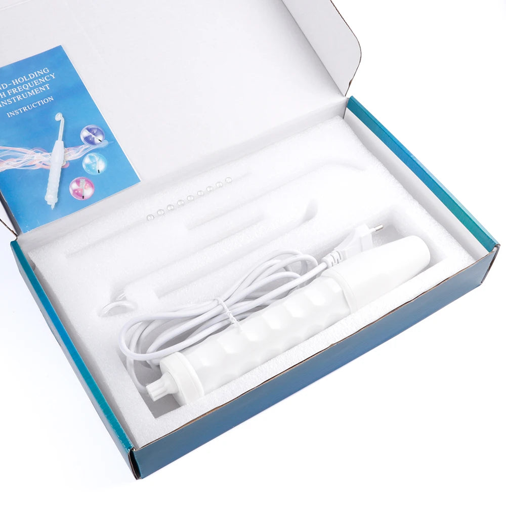 Portable high-frequency facial wand kit with white handle, power cord, and four glass electrode attachments in a box.