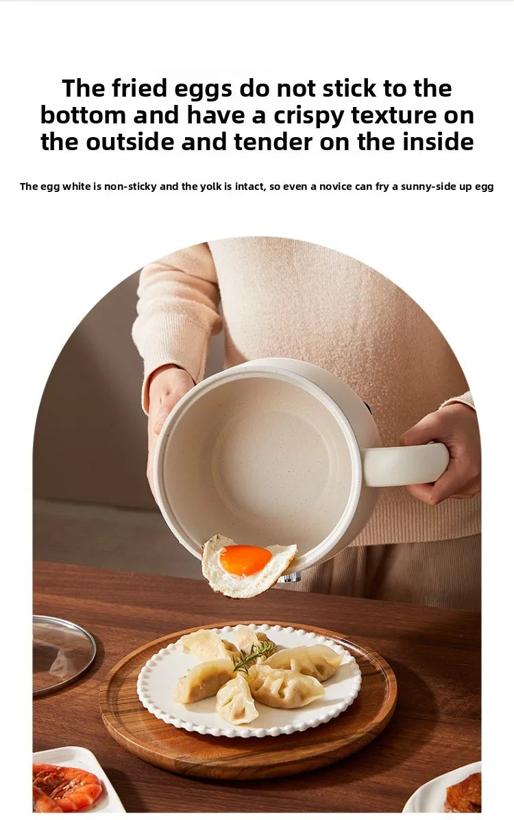 Electric hot pot with white ceramic nonstick inner pot, lid off and empty base