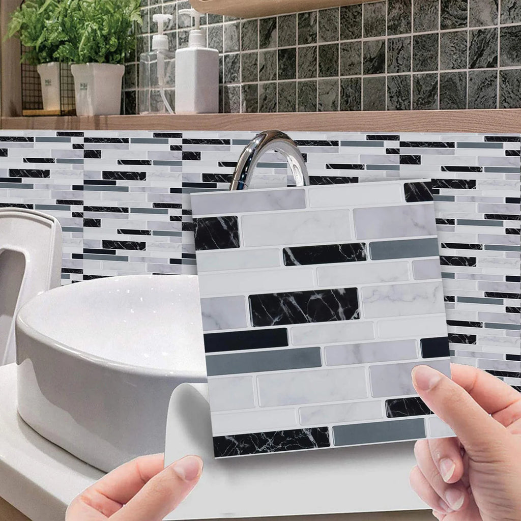 Self-adhesive mosaic tile sticker, blue-white and black brick pattern, hands adjusting placement