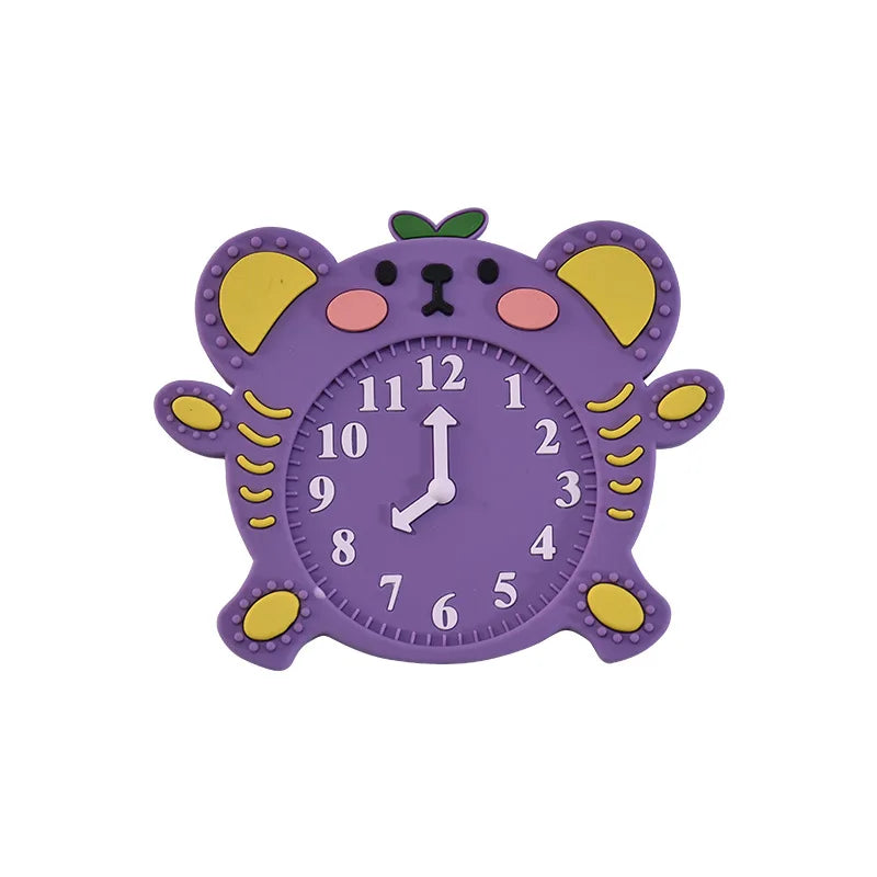 Purple clock-shaped silicone baby teething toy for soothing gums.