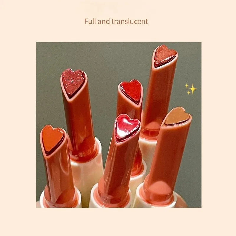 Heart-shaped moisturizing lip glaze pens with a translucent, mirror-like jelly finish in various warm shades.