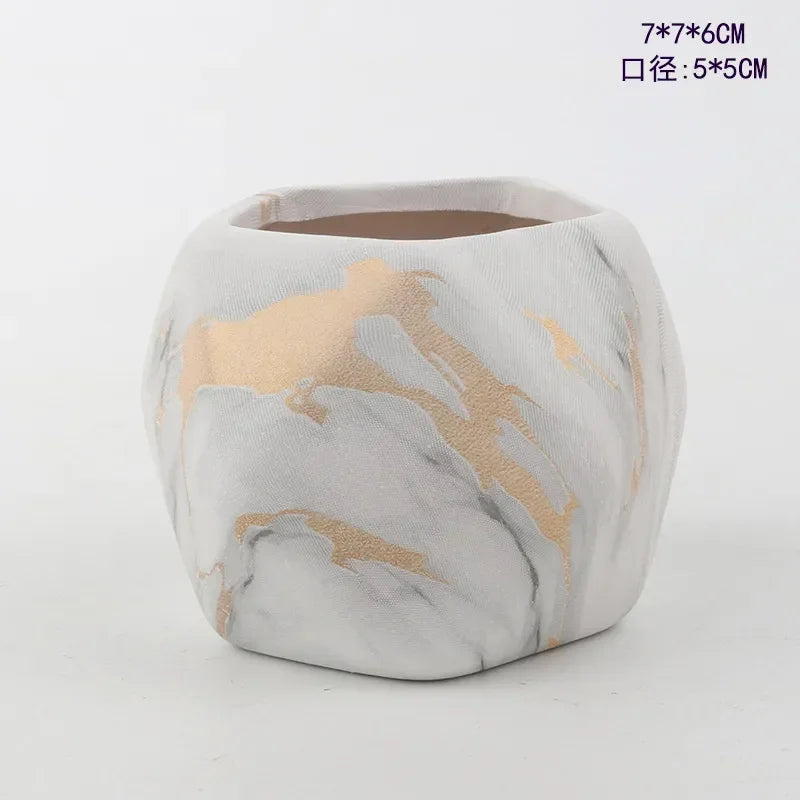 Ceramic succulent pot with white marble-look finish and gold-tan veining details