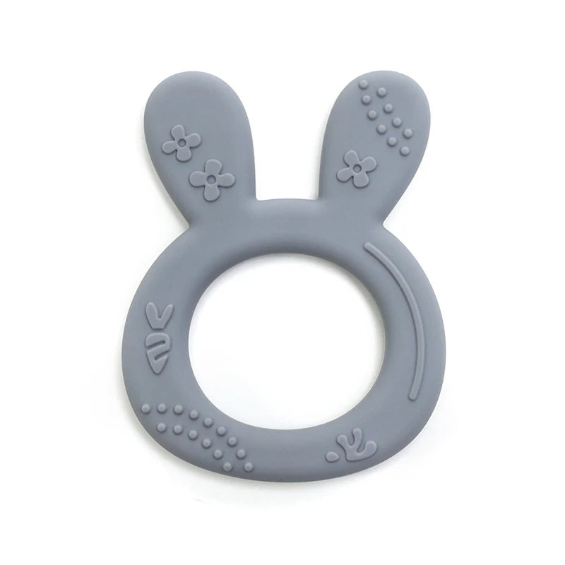 Grey silicone bunny teething ring for baby teething relief.