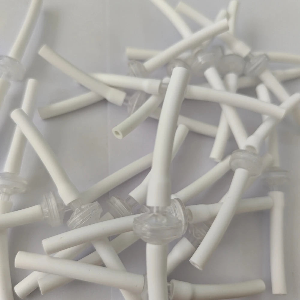 White disposable replacement connect tubes for Microneedle RF cartridge machines for skin lifting and acne scar removal.