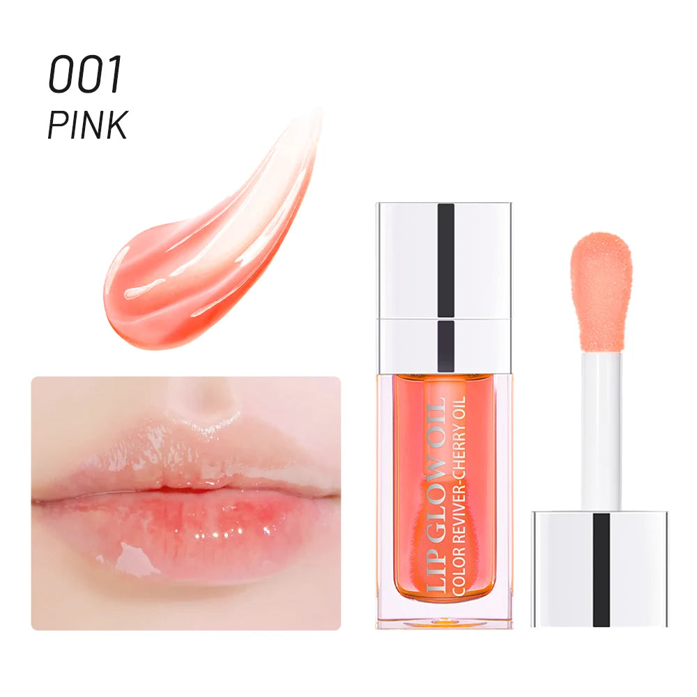 Pink crystal jelly lip oil with a glossy, plumping texture and applicator. Moisturizing tinted lip makeup for shiny lips.