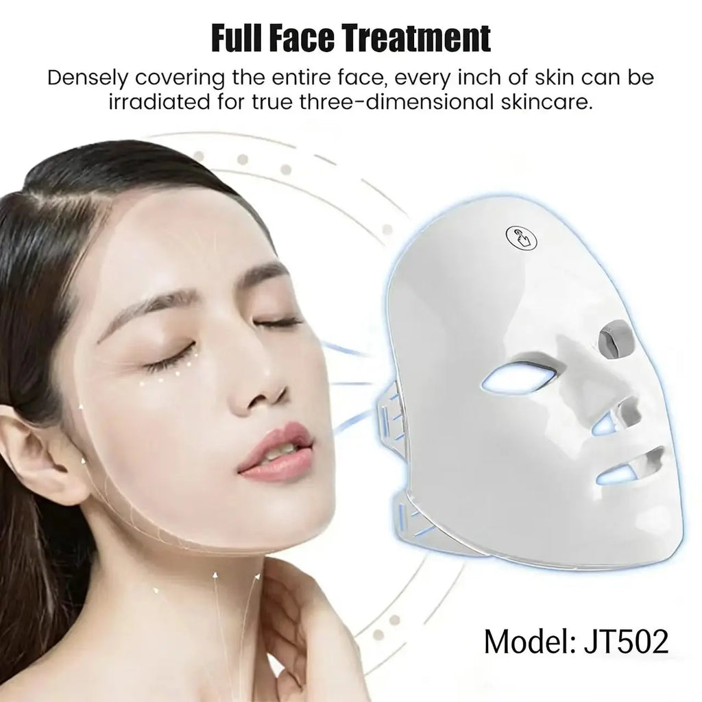 White, rechargeable LED facial mask for skin rejuvenation next to a woman’s face.