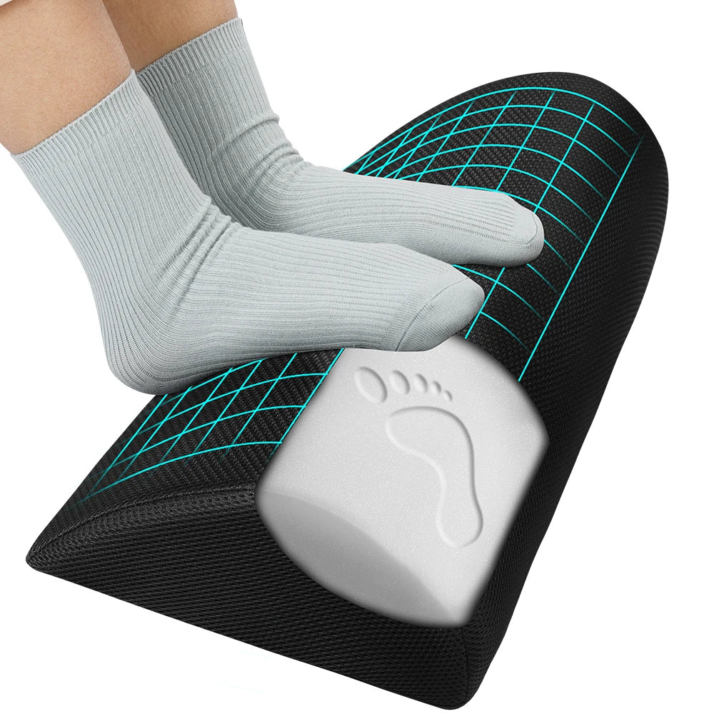 Black memory foam office footrest pillow under feet to improve sitting posture and leg comfort.