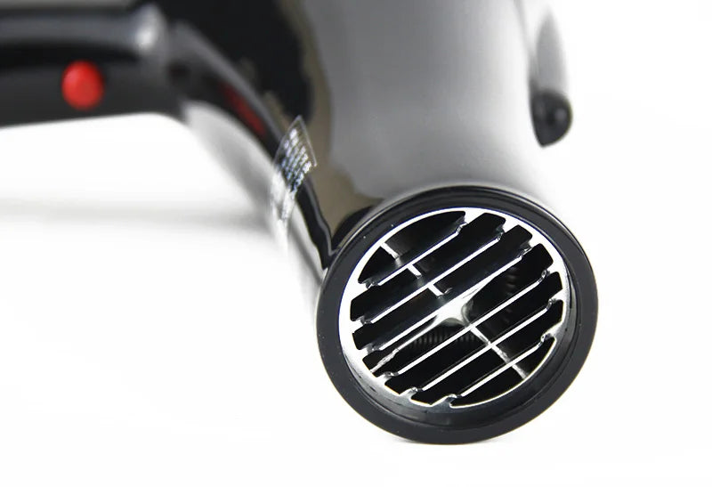 Professional 2100W black hair dryer with silver air outlet grate for salon styling and fast drying.