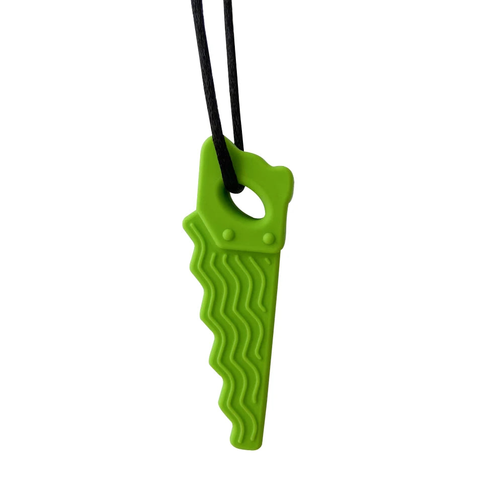 Green saw-shaped silicone baby teething toy for soothing sore gums.