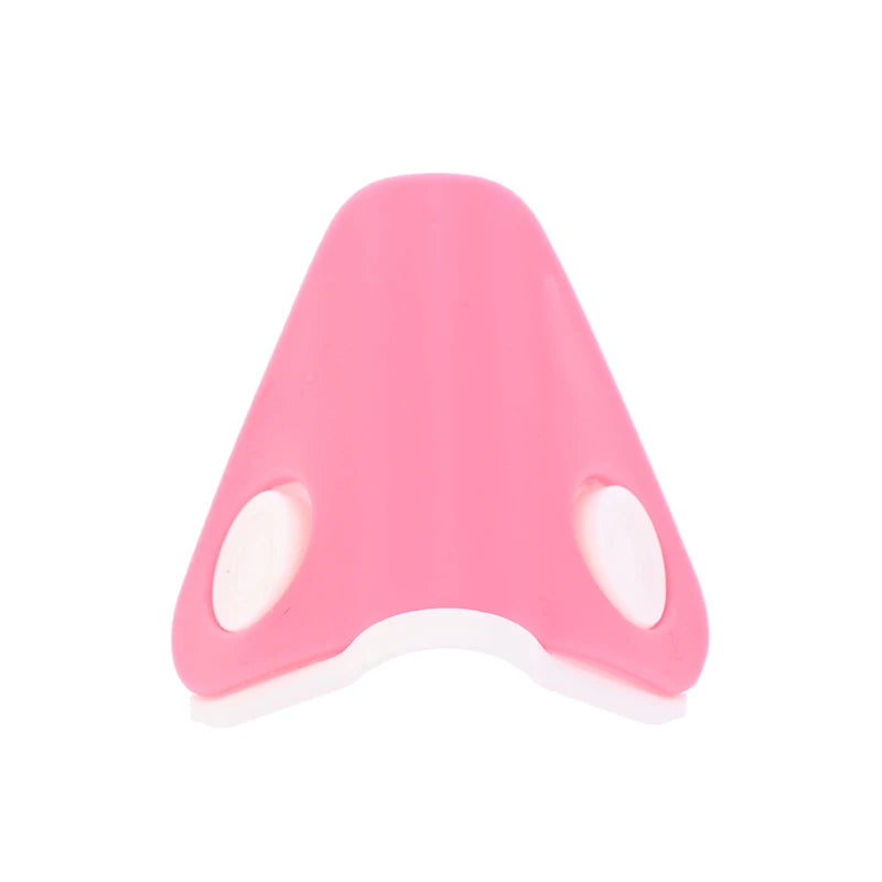 Pink nose shaper clip for lifting and straightening, a portable silicone facial beauty tool for bridge correction.