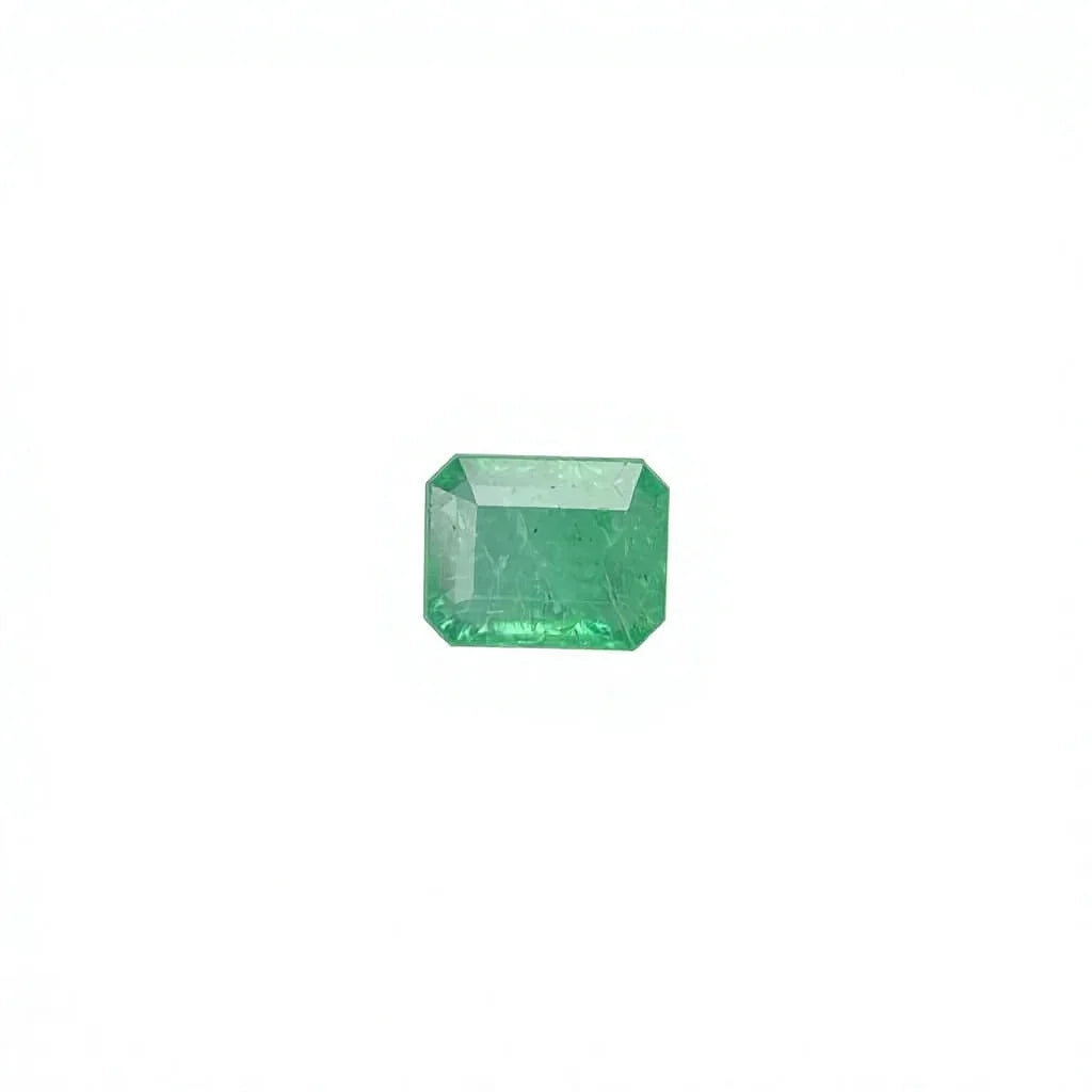 Green emerald-cut octagon loose gemstone on white background, rectangular step facets