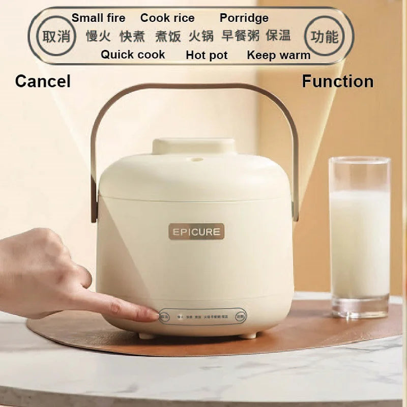 White mini electric rice cooker with front control panel, lid and brown carry handle.