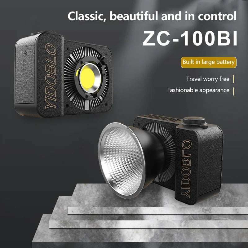 ZC-100BI compact LED video light with leather-textured body, cooling fins, and silver reflector for photography.