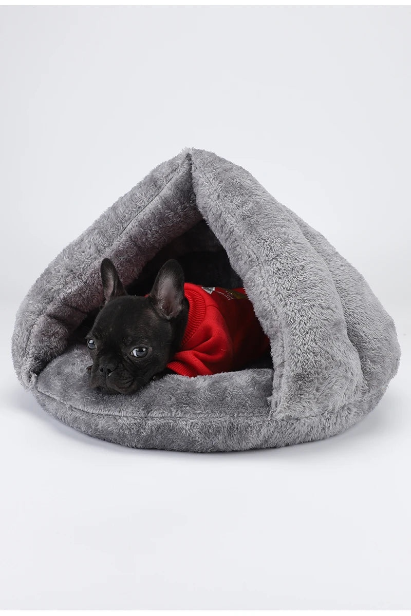French Bulldog in a cozy, grey plush hooded dog bed, perfect for warm, washable comfort for small pets.