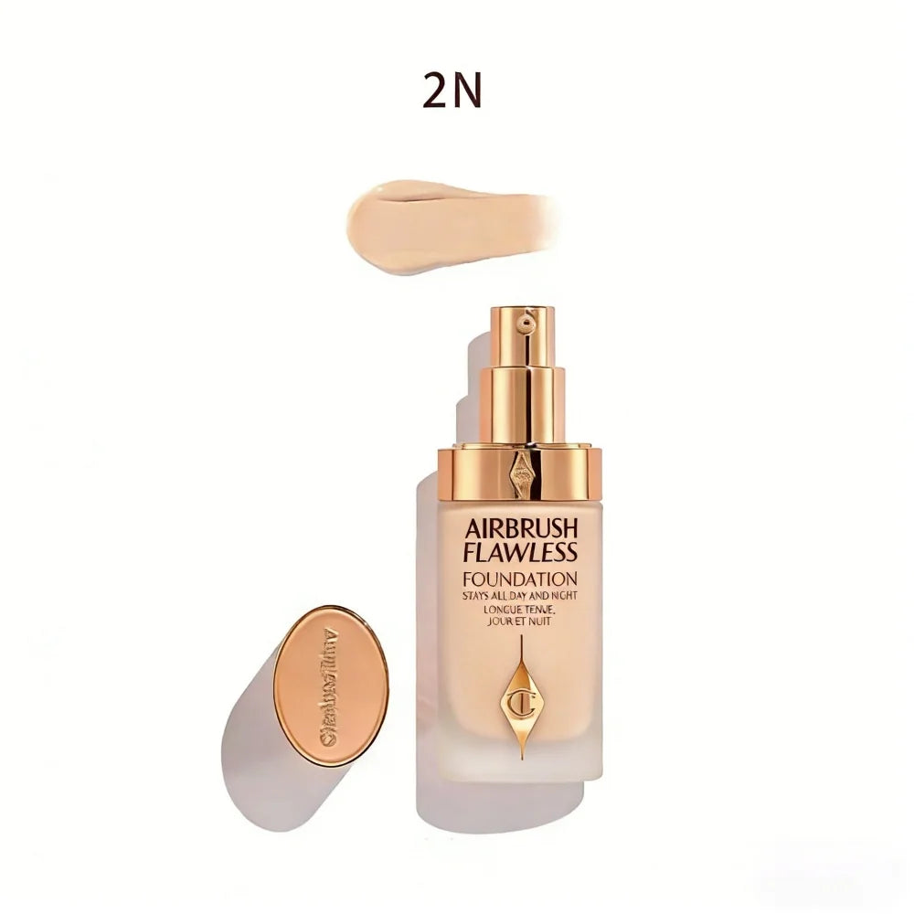 Charlotte Tilbury Airbrush Flawless Foundation in shade 2N with creamy liquid texture in a luxe gold pump bottle.