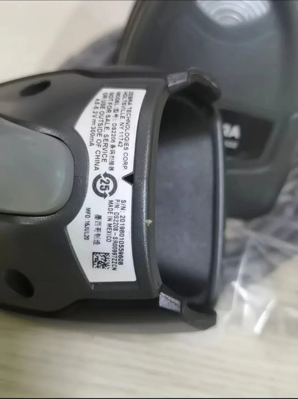 2D wired handheld scanner close-up of side label and connector area
