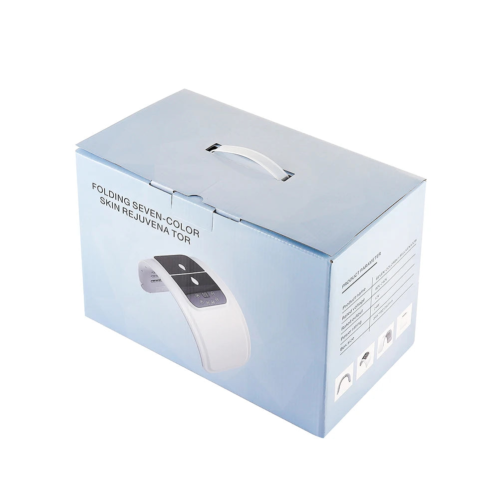 Light blue cardboard box for a white, folding seven-color LED skin rejuvenation device with a top carry handle.