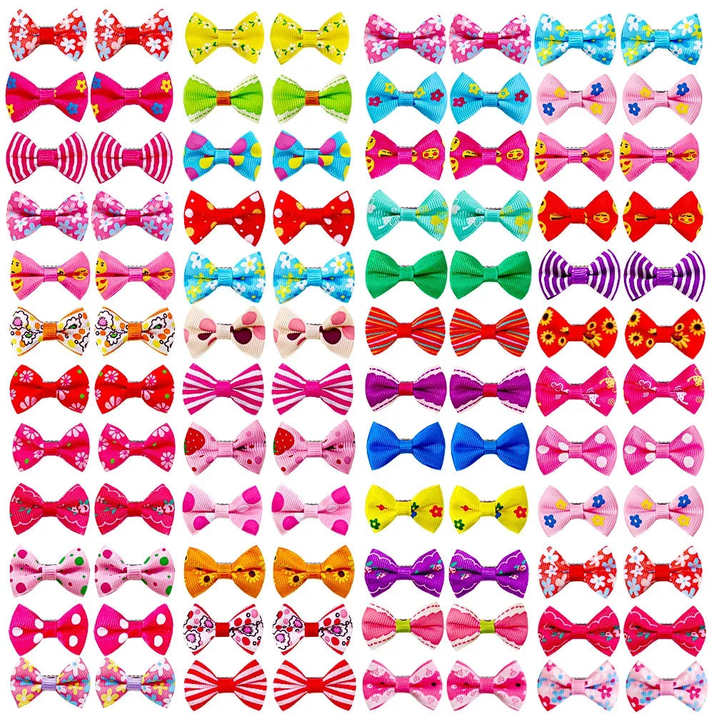 Colorful bow hair clips for small dogs and cats. Assorted patterned grooming barrettes for cute pet hair styling.